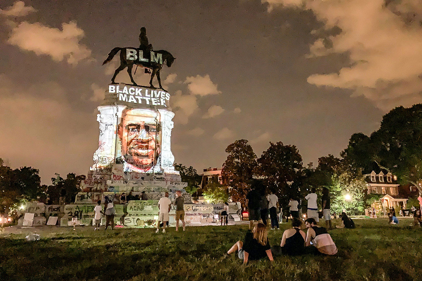 Locals watch images of notable Black people projected on the statue of Confederate general Robert E. Lee, created by lighting artist Dustin Klein at MDP Circle in Richmond. Photo by <a href="https://evergib.com/">EVERGIB.</a> Locals watch images of notable Black people projected on the statue of Confederate general Robert E. Lee, created by lighting artist Dustin Klein at MDP Circle in Richmond. Photo by <a href="https://evergib.com/">EVERGIB.</a>